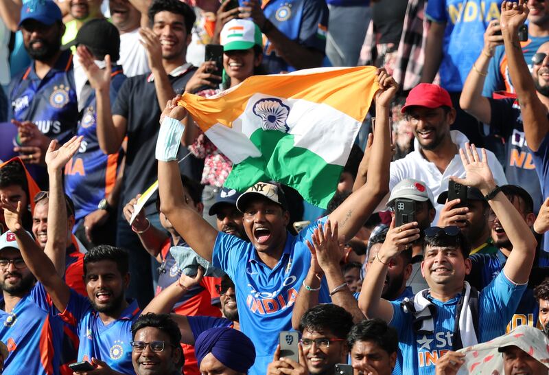 India fans cheer before the start of the game.