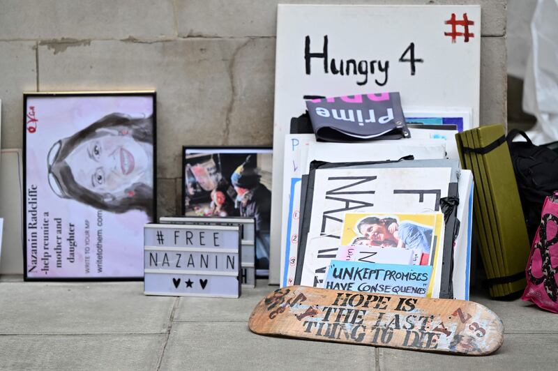 Posters stacked against a wall as Richard Ratcliffe, husband of Nazanin Zaghari-Ratcliffe, ended his hunger strike outside the Foreign Office in London in November 2021.  AFP