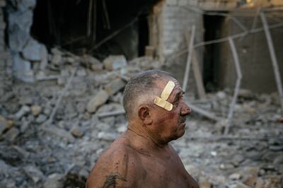 Oleksandr Shulga looks at his home, destroyed by a missile strike in Mykolaiv. AFP