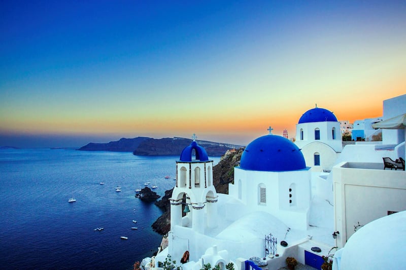 SANTORINI, GREECE - AUGUST 12: (EDITORS NOTE: Image processed using digital filters) A general view of the sunset in the picturesque village of Oia (Ia) on Santorini Island on August 12, 2017 in Mykonos, Greece. (Photo by Claudio Lavenia/Getty Images)