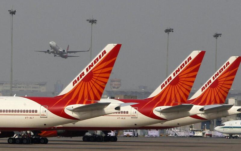 India's government is offering a 100 per cent stake in Air India to potential investors and is writing off most of the national carrier's debts. A deadline to submit bids is due at the end of August. Mustafa Quraishi / AP