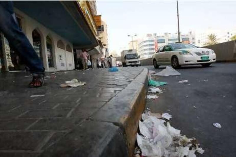 SHARJAH, UNITED ARAB EMIRATES, July 11: People walking on the street with full of litter on the road and streets at Rolla area in Sharjah.  (Pawan Singh / The National) For News. Story by Yasin