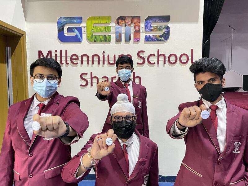 Siddharth Gusani, Trrishman Basoor, Adithya Suresh and Abdul Mohsin, (at back), who are pupils at Gems Millenium School Sharjah and received their first dose of the Sinopharm vaccine. All photos Gems Millenium School Sharjah