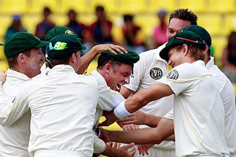 Australia's Michael Hussey celebrates with teammates after the dismissal of key threat, Mahela Jayawardena.