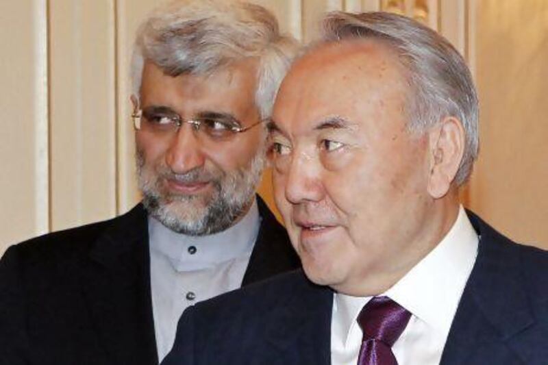 Kazakhstan's president, Nursultan Nazarbayev, right, meets Iran's chief nuclear negotiator, Saeed Jalili, in Almaty on Monday. Shamil Zhumatov / Reuters