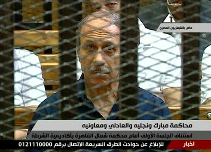 This video image taken from Egyptian State Television shows former Egyptian interior minister Habib el-Adly, in a cage of mesh and iron bars in a Cairo courtroom Wednesday Aug. 3, 2011. An ailing, 83-year-old Hosni Mubarak lay on a hospital bed inside a cage of mesh and iron bars in a Cairo courtroom Wednesday as his historic trial began on charges of corruption and ordering the killing of protesters during the uprising that ousted him. The scene, shown live on Egypt's state TV, was Egyptians' first look at their former president since Feb. 10, the day before his fall when he gave a defiant speech refusing to resign.   (AP Photo/Egyptian State TV)   EGYPT OUT *** Local Caption ***  Egypt Mubarak Trial.JPEG-04c7e.jpg