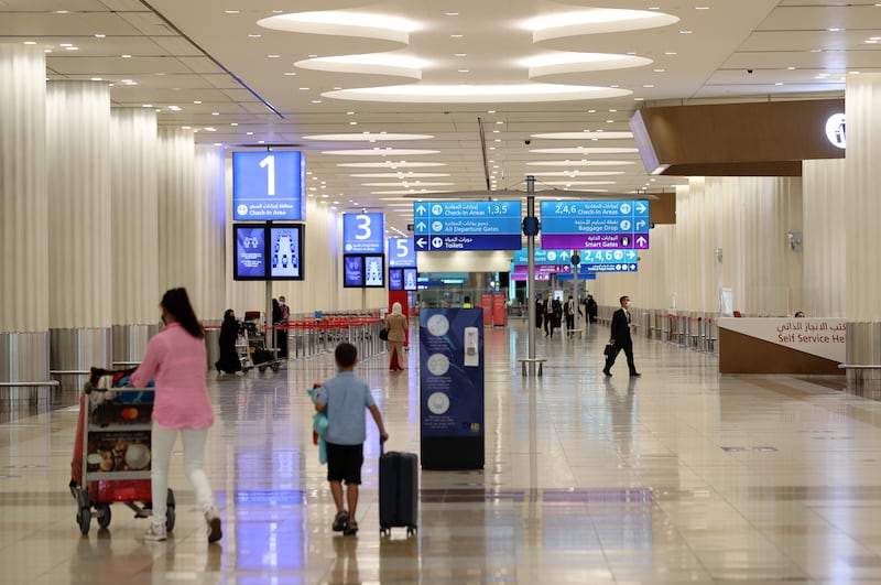 Travellers at Dubai International Airport's Terminal 3. Chris Whiteoak / The National
