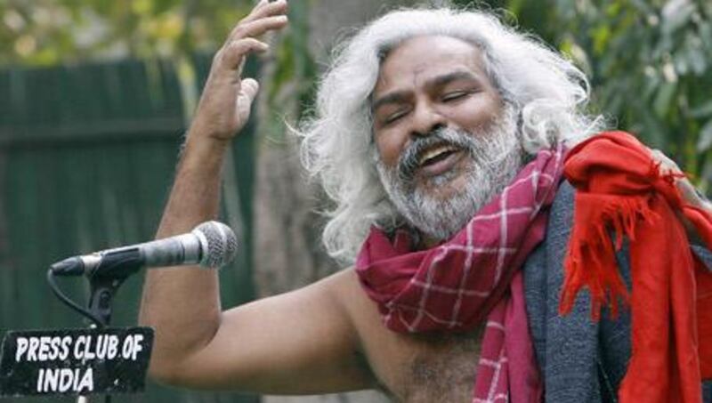 The famed Telugu balladeer and Naxalite activist Gummadi Vittal Rao - known in India as Gaddar - performs at the press club of India in New Delhi.