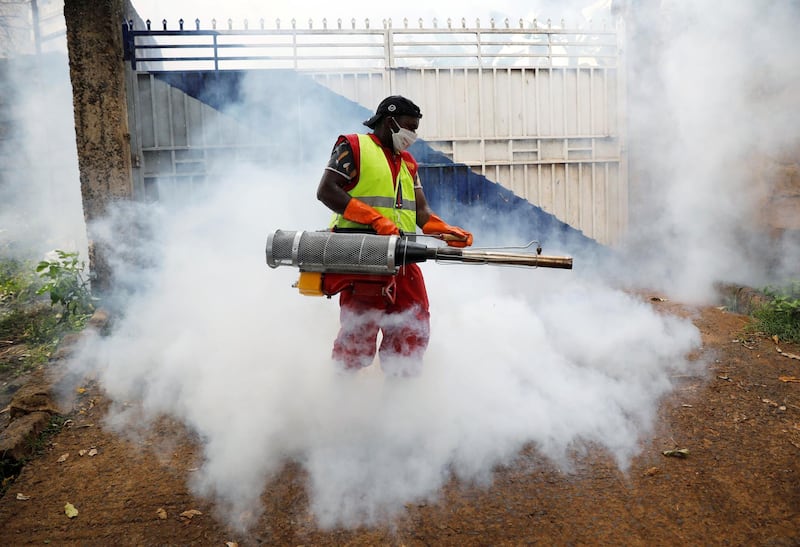 A volunteer sprays disinfectants to help fight the spread of coronavirus at the Raila Educational Centre in the Kibera slums in Nairobi, Kenya. Reuters
