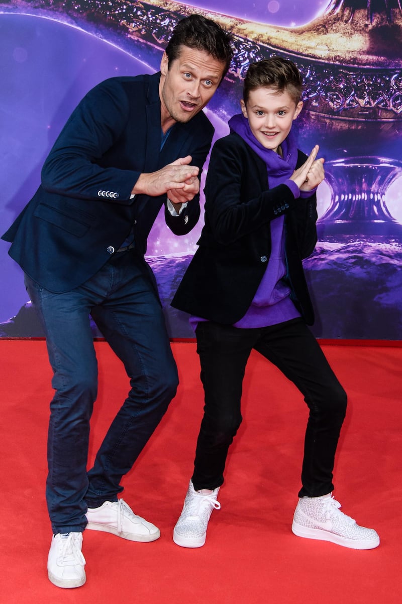 German actor Roman Knizka and his son Leo at the gala screening in Berlin. EPA.