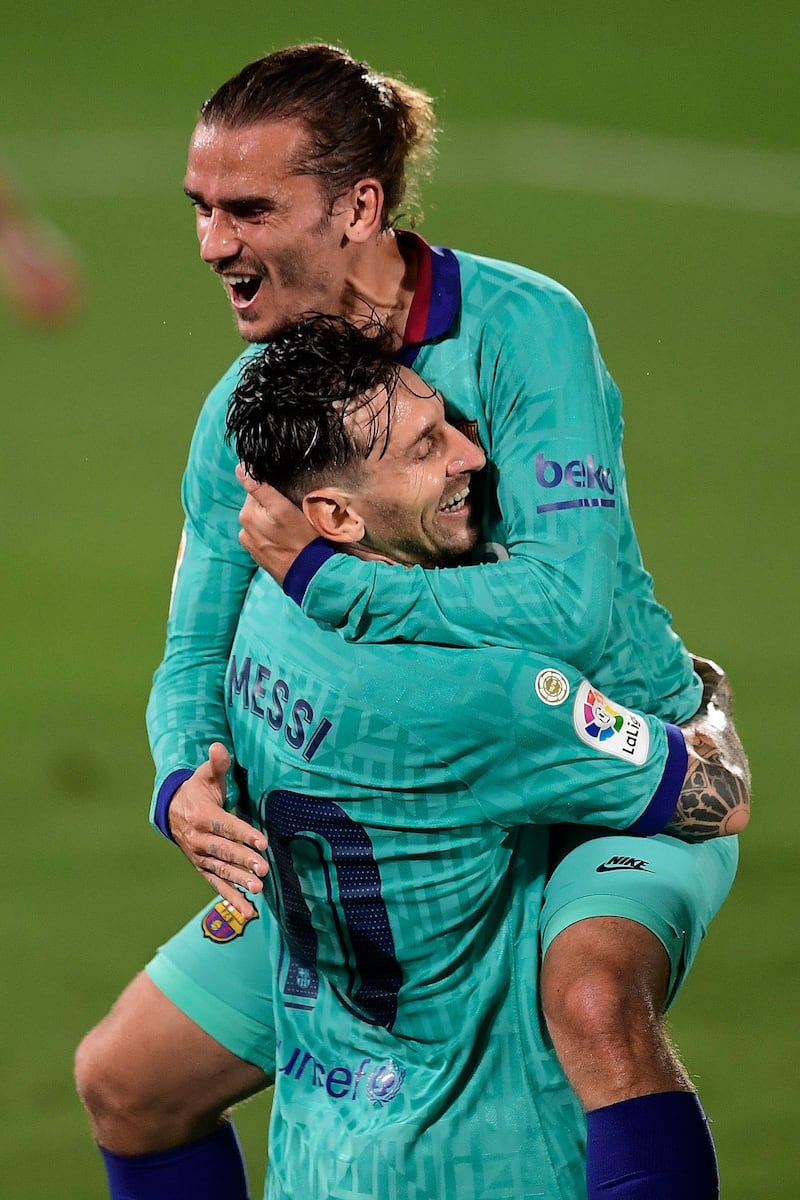 Barcelona forward Antoine Griezmann celebrates with Lionel Messi after scoring against Villarreal at the Madrigal stadium. AFP