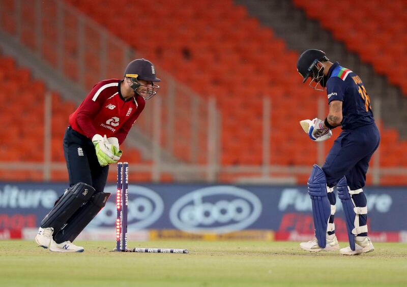 England wicketkeeper Jos Buttler stumps India captain Virat Kohli. PA