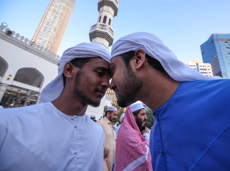 Muslims greet each other on the first day of Eid at the Sheikh Khalifa bin Zayed the First Mosque. Victor Besa / The National