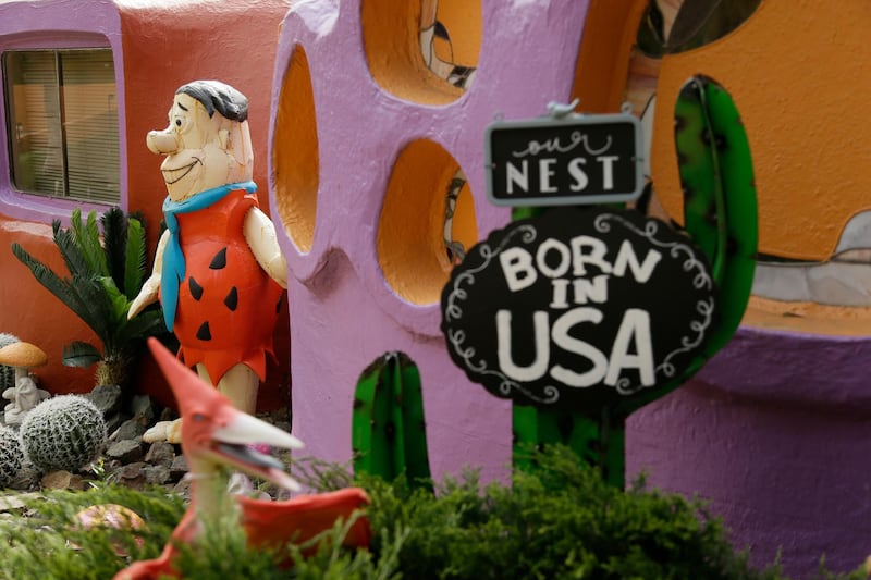 A statue of Fred Flintstone stands near the front entryway of the contentious Flintstone House in Hillsborough, California. AP