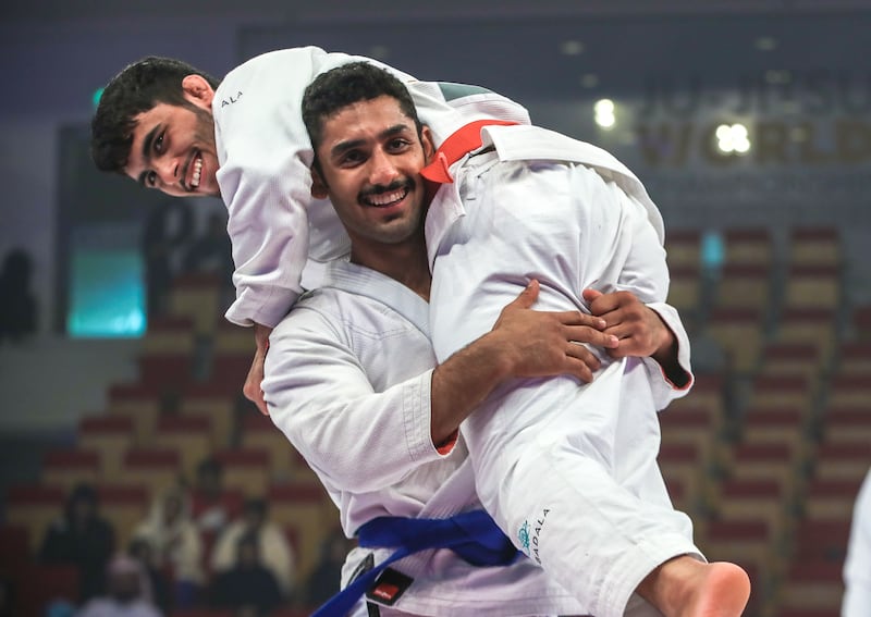 Khaled Al Shehhi, bottom, celebrates with UAE teammate Omar Al Fadhi after their gold medal match, won by Al Shehhi. Victor Besa / The National