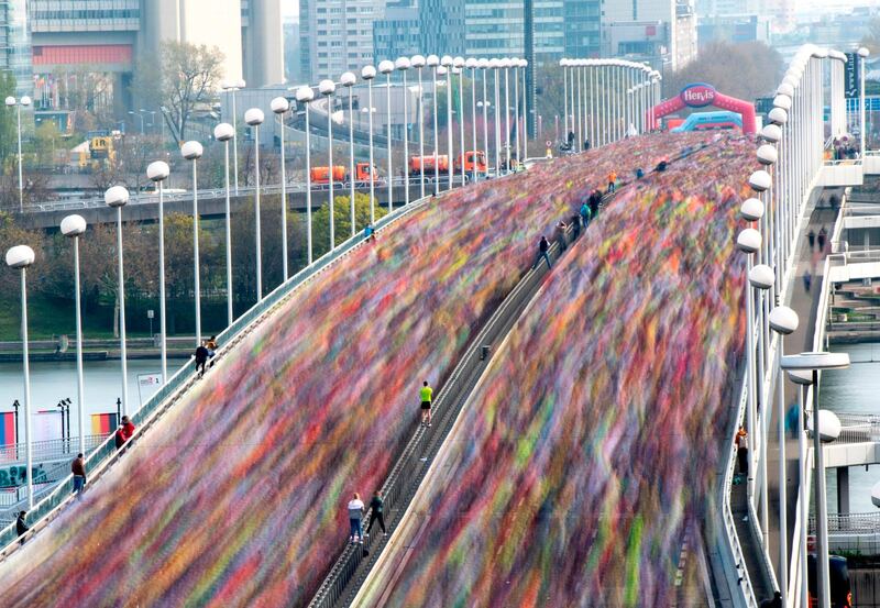 Competitors run on the Reichsbrucke bridge during the Vienna Marathon. AFP