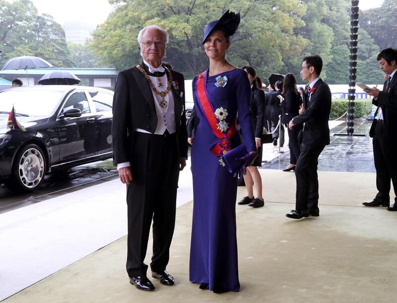 Sweden's King Carl XVI Gustaf and Crown Princess Victoria arrive at the Imperial Palace to attend the proclamation ceremony of Japan's Emperor Naruhito's ascension to the throne in Tokyo  on October 22, 2019. AFP