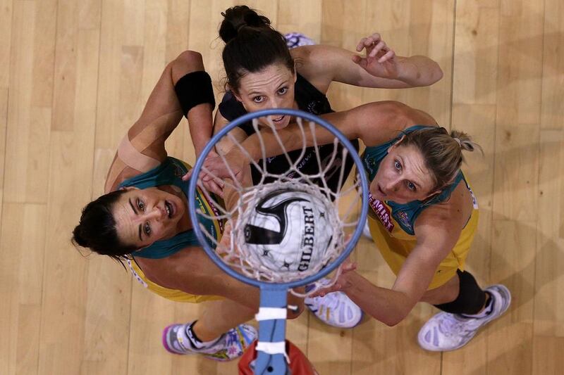 Sharni Layton of Australia, Baily Mes of New Zealand and Clare McMeniman of Australia keep an eye on the ball as they compete during the Constellation Cup International Test match between the New Zealand Sliver Ferns and the Australia Diamonds in Invercargill, New Zealand. Dianne Manson / Getty Images