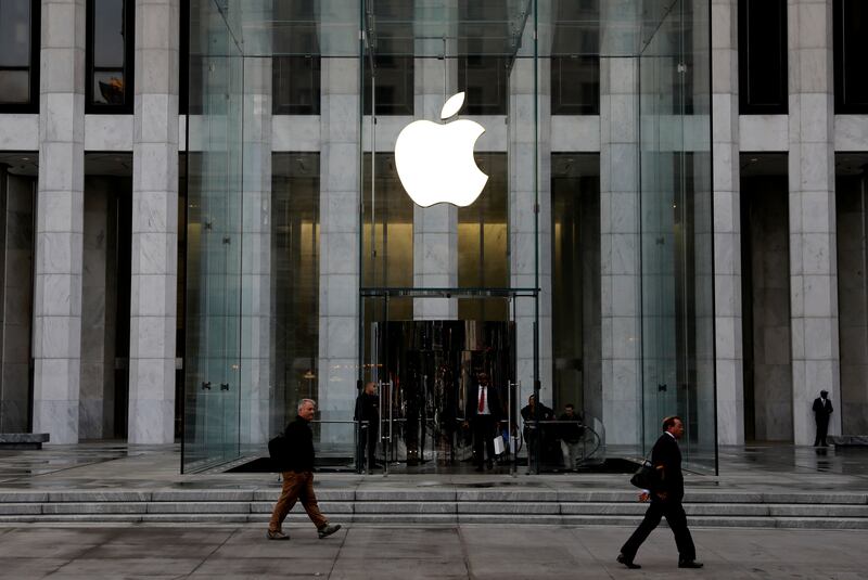 FILE PHOTO: The Apple Inc. logo is seen hanging at the entrance to the Apple store on 5th Avenue in Manhattan, New York, U.S., October 16, 2019. REUTERS/Mike Segar/File Photo