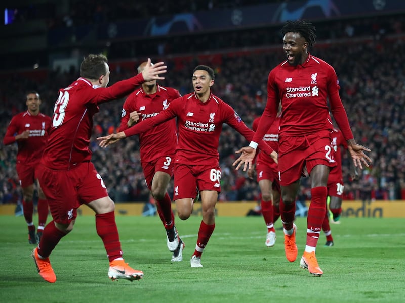 LIVERPOOL, ENGLAND - MAY 07:  Divock Origi of Liverpool (27) celebrates as he scores his team's fourth goal with team mates during the UEFA Champions League Semi Final second leg match between Liverpool and Barcelona at Anfield on May 07, 2019 in Liverpool, England. (Photo by Clive Brunskill/Getty Images)