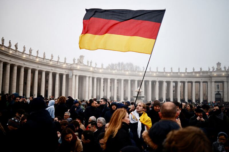 The flag of Benedict's native Germany is waved at St Peter's Square. Reuters