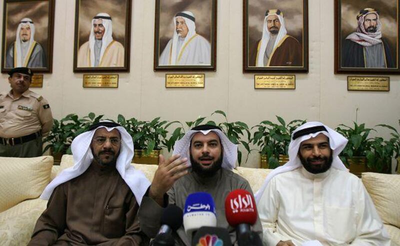 The Kuwaiti MPs Jamaan al Harbash, centre, Nasser al Sanea, left, and Abdulaziz al Shayji address a joint press conference at the national assembly in Kuwait City on March 2.