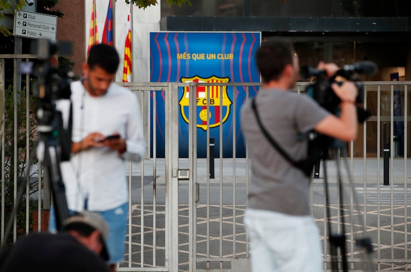 Members of the media outside Barcelona's offices.