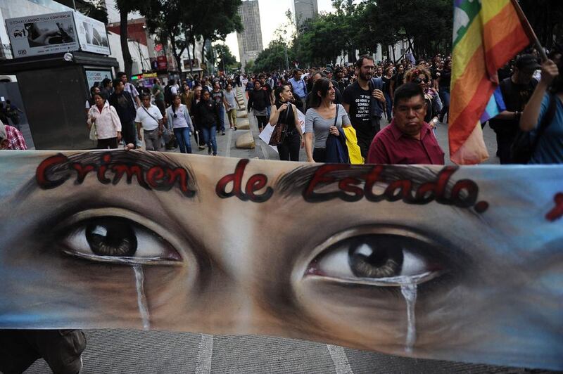 Parents, other relatives, students and people in general take part in a protest in Mexico City to commemorate the second anniversary of the Ayotzinapa teachers school’s students disappearance.  The students, from a rural teachers college in the southern state of Guerrero, disappeared after they were attacked by local police in the city of Iguala. AFP