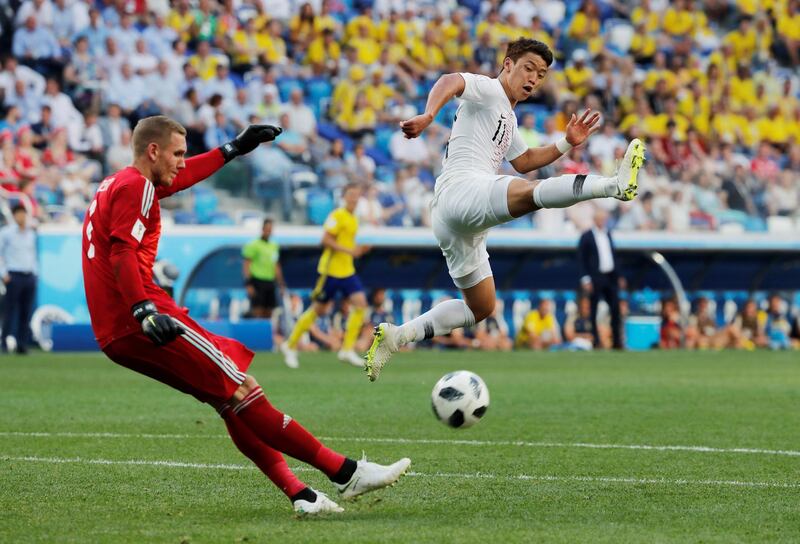 Sweden goalkeeper Robin Olsen makes a clearance. Carlos Barria / Reuters