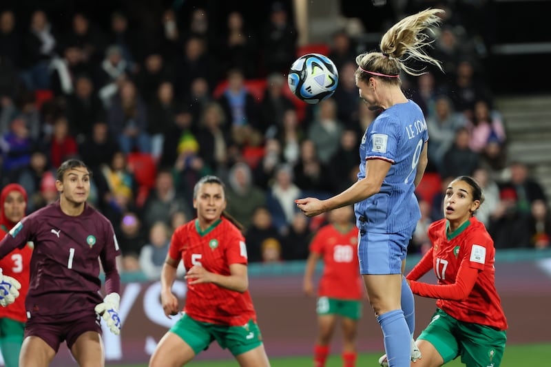 France's Eugenie Le Sommer heads in the fourth goal against Morocco. AP 