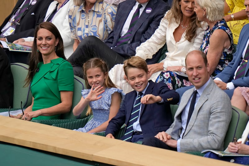Kate, Princess of Wales, Princess Charlotte, Prince George and Prince William sit in the Royal Box on Centre Court. AP 