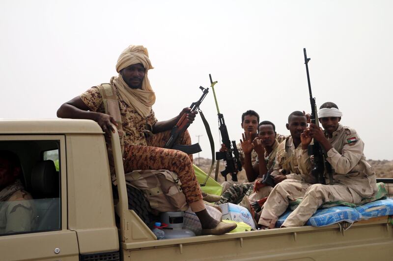 epa06803022 Sudanese forces fighting alongside the Saudi-led coalition in Yemen gather near the outskirts of the western port city of Hodeidah, Yemen, 12 June 2018. According to reports, the Saudi-led military coalition and Yemeni government forces continue to send reinforcements toward the port city of Hodeidah, preparing to launch an assault on the Houthis-controlled main port of Yemen.  EPA/NAJEEB ALMAHBOOBI