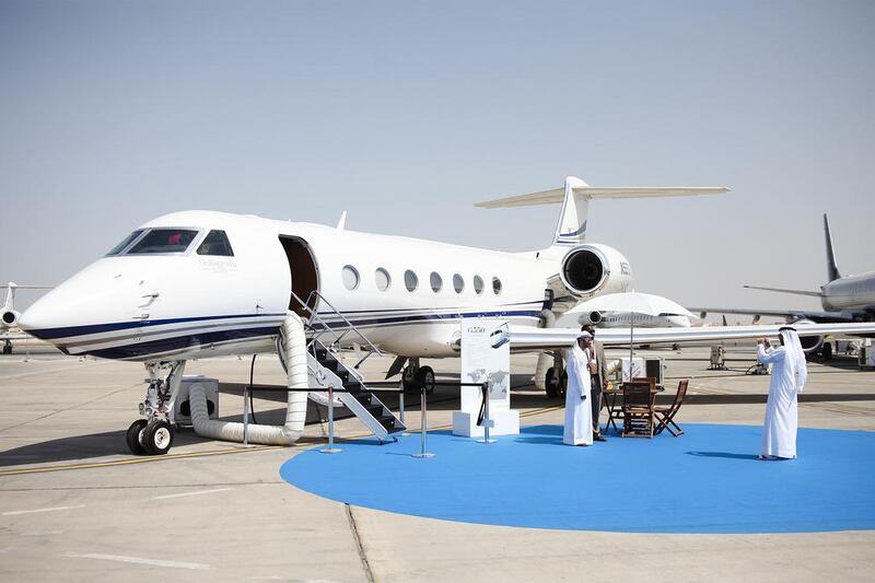 Visitors pose for a photo in front of a Gulfstream G550. Lee Hoagland / The National