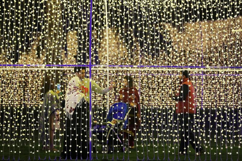 SHARJAH , UNITED ARAB EMIRATES , FEB 7 – 2018 :- People at the Palm Oasis near Al Noor Masjid during the Sharjah Light Festival in Sharjah.  (Pawan Singh / The National) For News. 