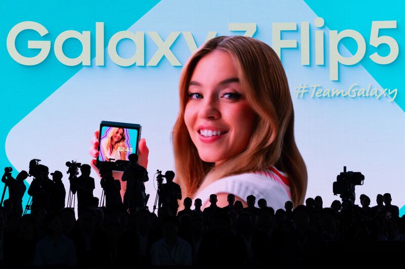 A photograph of actress Sydney Sweeney projected on the stage during Samsung's Galaxy Unpacked event in Seoul, South Korea. SeongJoon Cho / Bloomberg