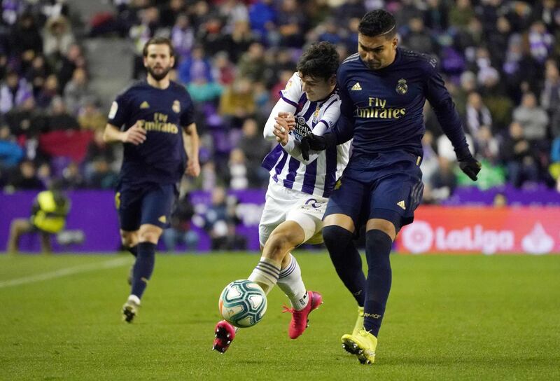 Real Valladolid's Turkish forward Enes Unal vies with Real Madrid's Brazilian midfielder Casemiro. AFP