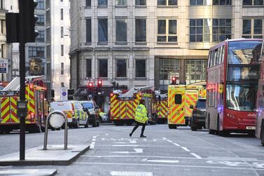 Police at the scene of an incident at London Bridge in London, Britain. EPA/FACUNDO ARRIZABALAGA