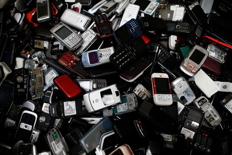 This photo taken on May 3, 2017 at Morphosis plant in Le Havre, northwestern France, shows a pile of discarded electrical and electronic components. - Morphosis extracts and refines rare and precious metals from electrical and electronic devices in Europe. (Photo by CHARLY TRIBALLEAU / AFP)