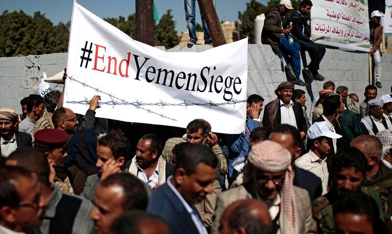 FILE - In this Dec. 10, 2018 file photo, Yemenis take part in a protest calling for the reopening of Sanaa airport to receive medical aid, in front of the U.N. offices in Sanaa, Yemen. An Associated Press investigation found some of the United Nations aid workers sent in to Yemen amid a humanitarian crisis caused by five years of civil war have been accused of enriching themselves from an outpouring of donated food, medicine and money. Documents from an internal probe of the U.N.â€™s World Health Organization uncovered allegations of large funds deposited in staffersâ€™ personal bank accounts, suspicious contracts, and tons of donated medicine diverted or unaccounted for. (AP Photo/Hani Mohammed, File)