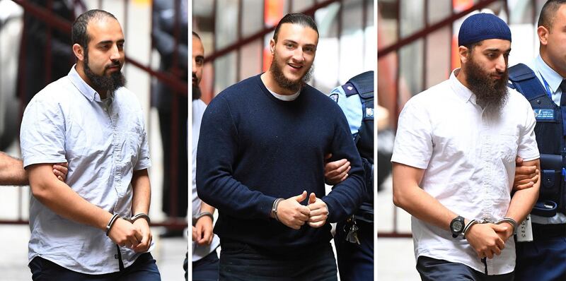 In this composite image of Hamza Abbas, left, Ahmed Mohamed and Abdullah Chaarani, right, arrive at the Supreme Court of Victoria, in Melbourne, Australia, Friday, Nov. 29, 2019. Mohamed, Chaarani and Abbas were given lengthy prison sentences over preparing a mass attack around Christmas 2016 involving explosives and knives at Federation Square, a popular downtown restaurant and entertainment precinct in Melbourne. (James Ross/AAP Image via AP)