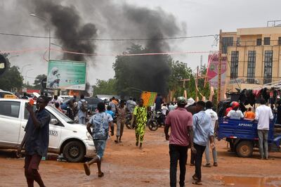 Supporters of the Nigerien defence and security forces attack the headquarters of the PNDS, the party of overthrown President Mohamed Bazoum, in Niamey on July 27. AFP