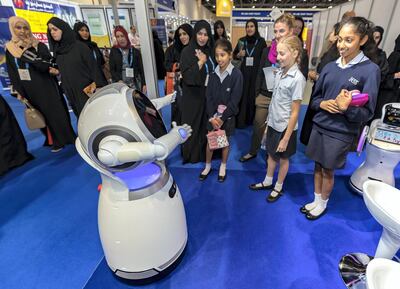 Dubai, United Arab Emirates - February 26, 2019: JESS students interact with a robot that plays music and dances during GESS Dubai 2019, the MENA regionÕs largest and leading education show. Tuesday the 26th of February 2019 at World trade centre, Dubai. Chris Whiteoak / The National