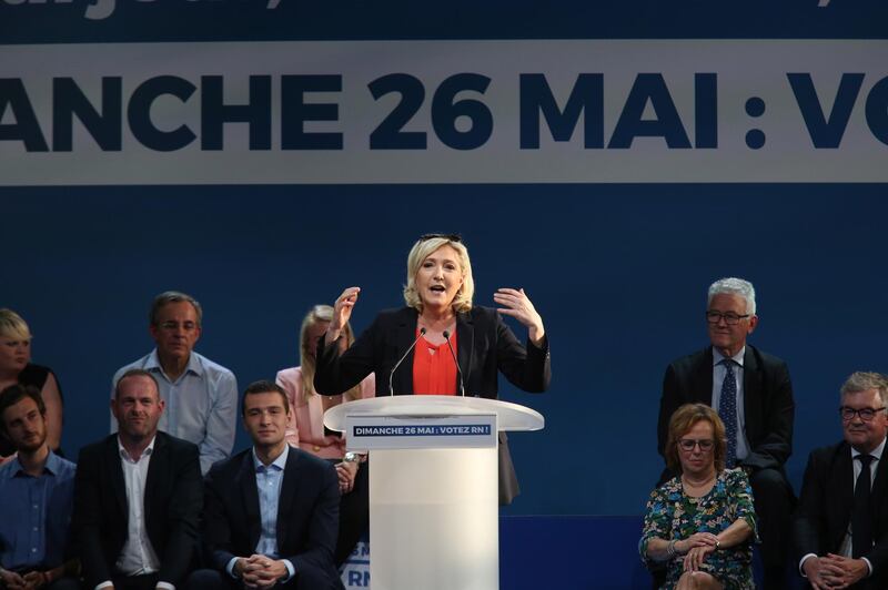 epa07598171 French far-right Rassemblement National (RN) President and member of Parliament Marine Le Pen delivers a speech flanked by RN party head candidate for European elections Jordan Bardella (3-L), in Henin Beaumont, France, 24 May 2019. The European Parliament election is held by member countries of the European Union (EU) from 23 to 26 May 2019.  EPA/THIBAULT VANDERMERSCH