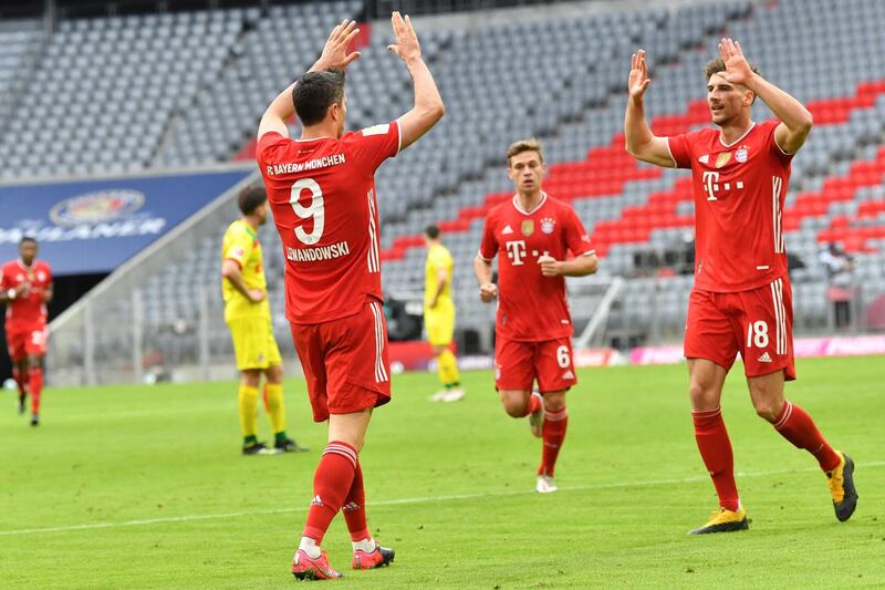 Bayern Munich's Robert Lewandowski Leon Goretzka celebrate a goal. AFP