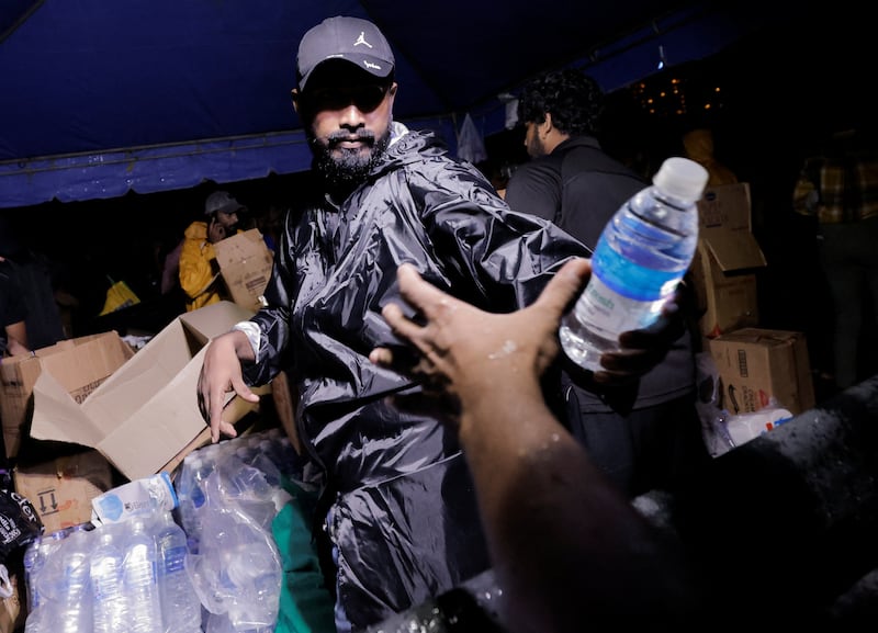 Water bottles are shared among protesters inside Gota-Go Village in Colombo, Sri Lanka. Reuters