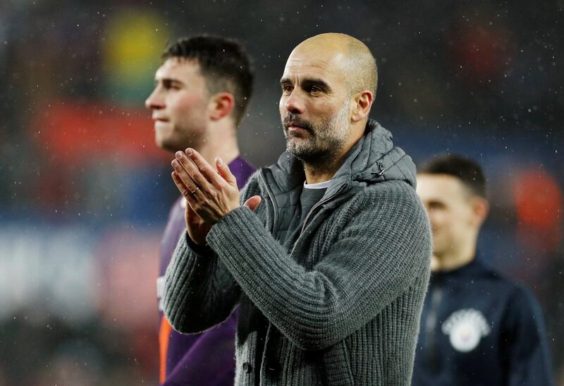 Soccer Football - FA Cup Quarter Final - Swansea City v Manchester City - Liberty Stadium, Swansea, Britain - March 16, 2019  Manchester City manager Pep Guardiola applauds fans after the match            Action Images via Reuters/John Sibley
