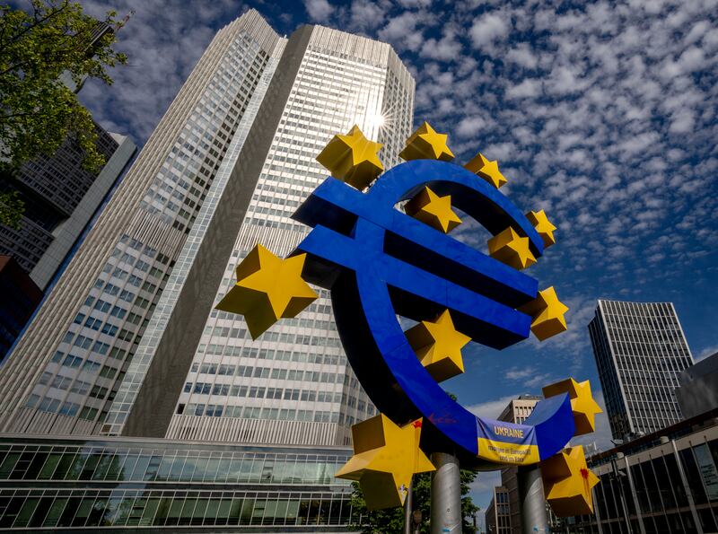 A euro sculpture stands in front of the former European Central Bank in Frankfurt, Germany. The currency has fallen to its lowest level in 20 years against the US dollar. AP