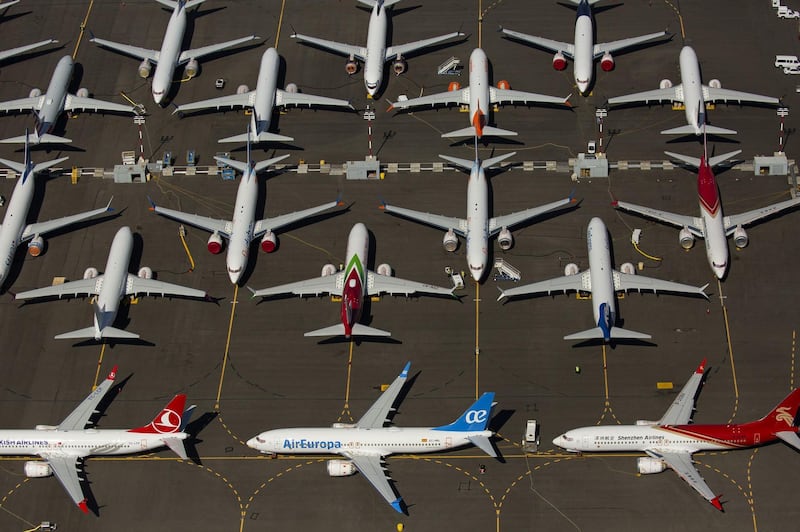 (FILES) In this file photo taken on August 13, 2019, Boeing 737 MAX airplanes are seen parked near Boeing Field in Seattle, Washington.    Nearly six months after its 737 MAX jets were grounded, Boeing is now close to applying to recertify the aircraft, according to sources, but the timeframe for flights to resume remains murky. Regulators will have final say on when the planes to return to service, clouding the outlook, in part because of signs of discord between US and international regulators. / AFP / GETTY IMAGES NORTH AMERICA / David Ryder
