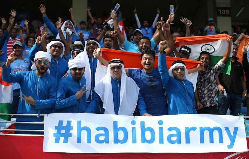 Indian supporters cheer for their team before the start of the match. AP Photo