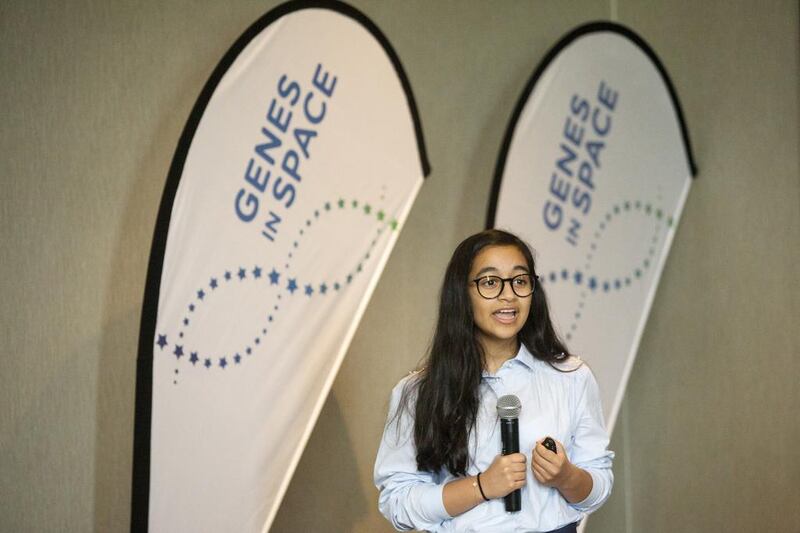 Alia Al Mansoori, 14, winner of the Genes in Space competition, makes her presentation yesterday. Christopher Pike / The National